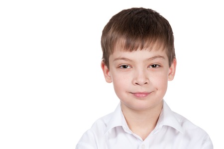 Portrait of the happy boy on a white backgroundの写真素材