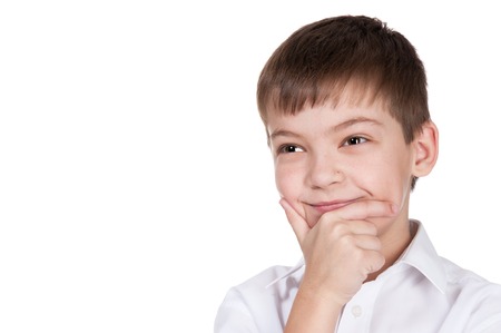 Portrait of the happy boy on a white backgroundの写真素材