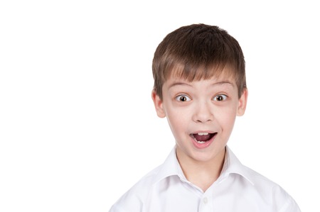 Portrait of the staggered boy on a white backgroundの写真素材