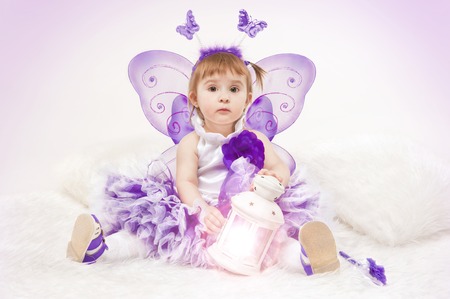 Beautiful little girl dressed as a butterflyの写真素材