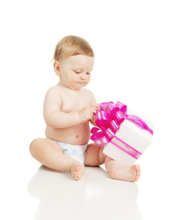 The small child with a gift in the hands, isolated on whiteの写真素材