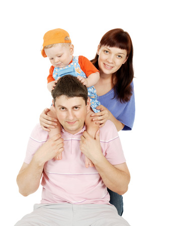 Portrait of young parents and the small son on a white backgroundの写真素材