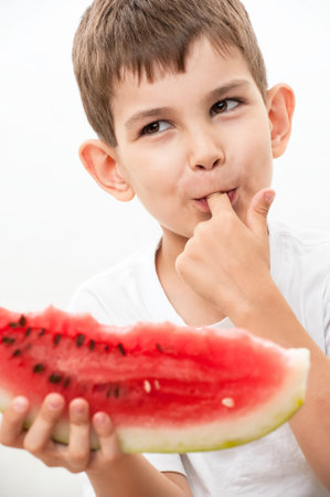 Little boy with watermelon in handsの写真素材