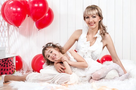 Portrait of mother and daughter on her birthdayの写真素材
