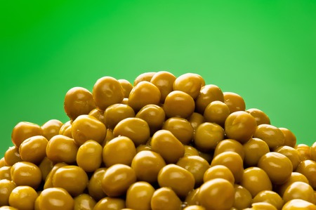 Pile of canned green peas close-upの写真素材