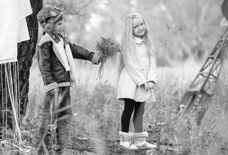 Meeting the young aviator with the girl in the field autumn clear dayの写真素材
