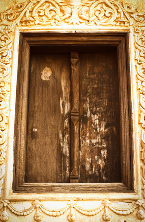 ancient wooden window in Thai churchの写真素材