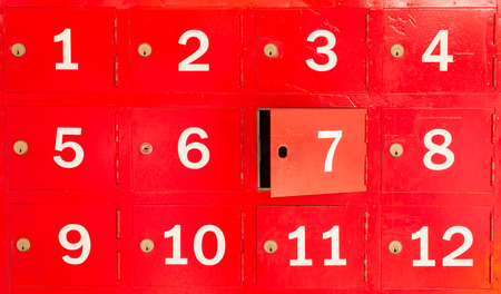 red locker with number in front of boxの写真素材