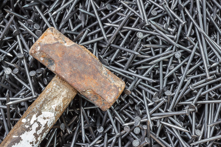 hammer on many screws for industrial workの写真素材