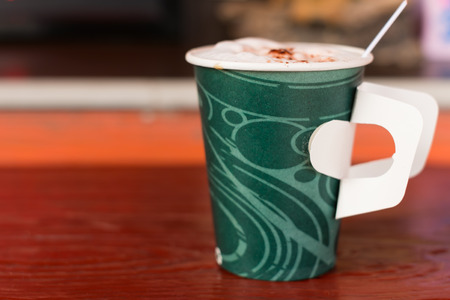 paper cup of coffee in cafeの写真素材