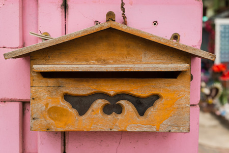 wood mailbox with pink backgroundの写真素材