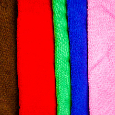 many colorful towels on isolated backgroundの写真素材