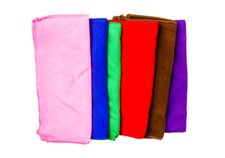 many colorful towels on isolated background