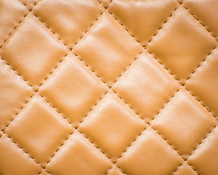 yellow color leather background and textureの写真素材