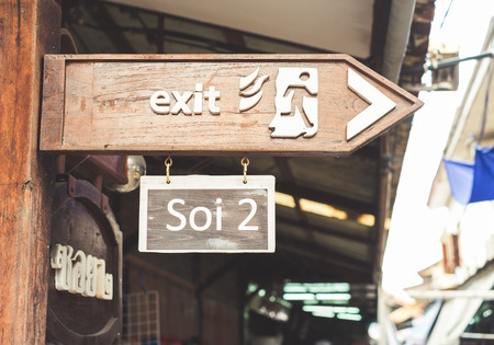 exit wood signboard with retro toneの写真素材