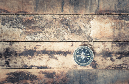 old compass on grunge woodの写真素材