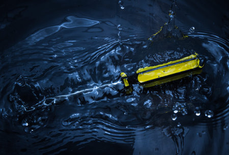 screwdriver in water splash with low key tone