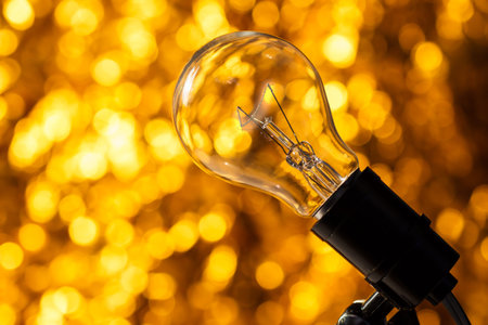glass lamp with gold light blur background