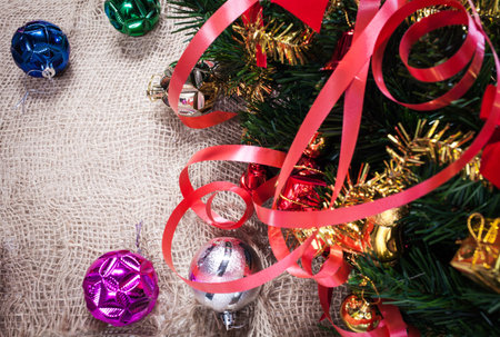 gift ornament and christmas tree on fabric background
