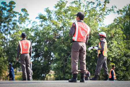 SAKAEO, THAILAND - December 11, 2015 : Traffic policeman officer works on a busy road. Police   make...