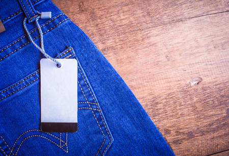 white paper label on blue jeanの写真素材