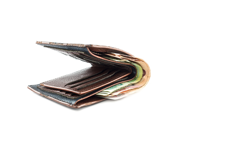 wallet with money inside on isolated backgroundの写真素材