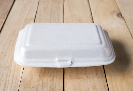 Empty foam box on wood backgroundの写真素材