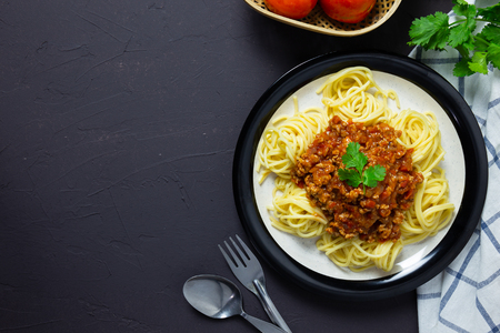 delicious homemade plate of spaghetti on black board, italian food. top viewの写真素材