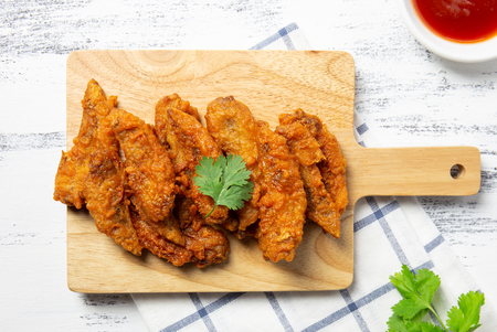 Fried chicken wings on wooden board. breaded crispy chicken serve with 
ketchupの写真素材