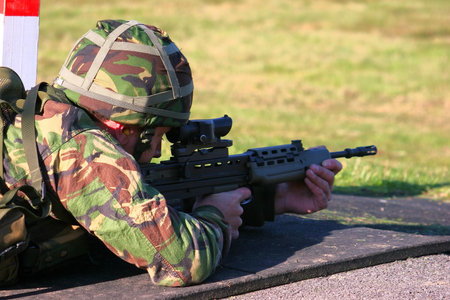 A Royal Navy sailor firing an SA80 assault rifle