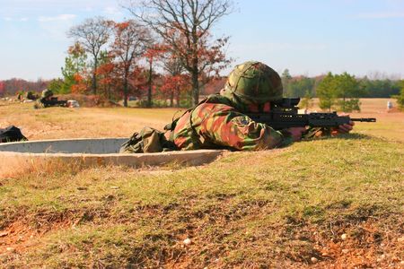 Soldiers firing SA80 rifles on a rangeの写真素材