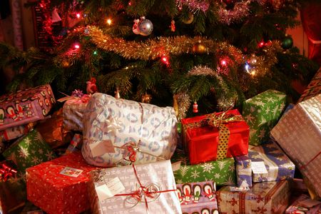 Family presents around the christmas treeの写真素材