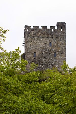 An ancient castle keep amongst the trees in Walesの写真素材