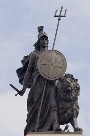 Proud Britannia, with sword in hand with lion standing readyの写真素材