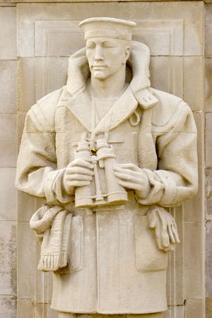 A statue of a Second World War Royal Navy Sailor guards the names of the dead at the Royal Navy war memorial, Plymouth, England.の写真素材