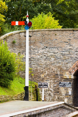 A signal post on the platform of an english preserved steam railwayの写真素材