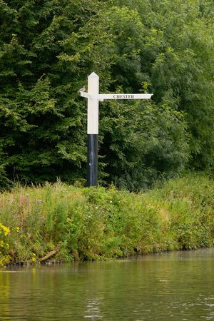 A canal signpost pointing the way to Chester on an english canalの写真素材