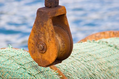 A pulley on the stern of a fishing boatの写真素材