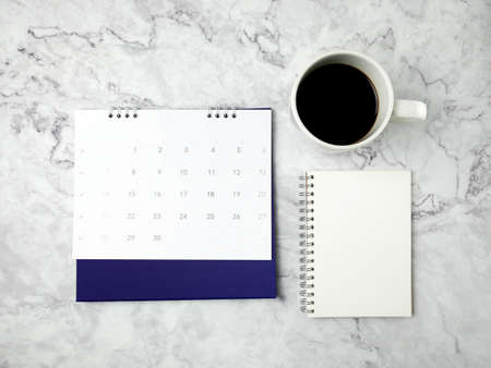 Notebook on marble texture background.の写真素材