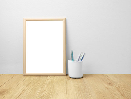 Blank frames mockup on wooden floor with penの写真素材