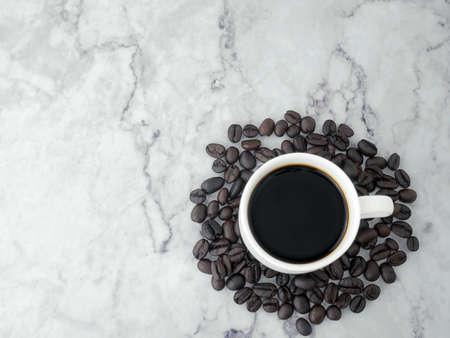 Coffee cup on marble texture background.の写真素材
