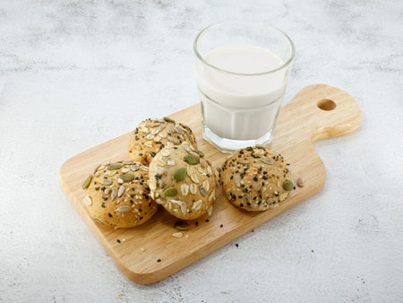 Whole grain bread with milk on texture background.