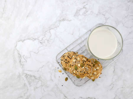 Whole grain bread with milk on marble texture background.の写真素材