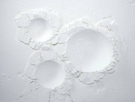 White flour texture background. Abstract powder texture. White powder surface with cracks and a round crater.の写真素材