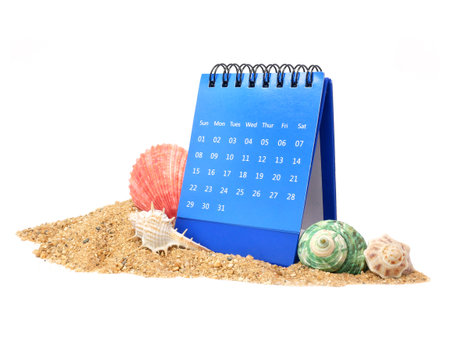 Calendar on pile of sand isolated on white background, Side viewの写真素材