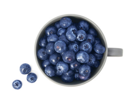 Blueberries in cup isolated on white backgroundの写真素材