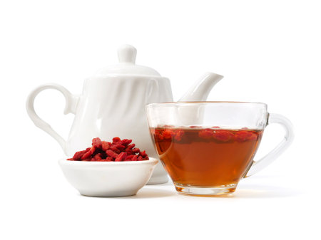 Tea set with goji berries isolated on white backgroundの写真素材