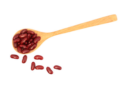 Red kidney beans in wooden scoop isolated on white backgroundの写真素材