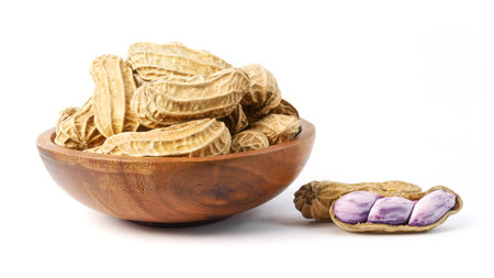 Boiled peanuts in wooden bowl isolated on white background