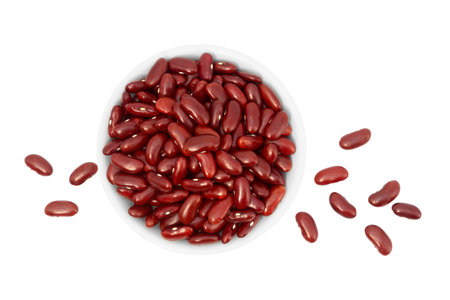 Red kidney beans in bowl isolated on white background